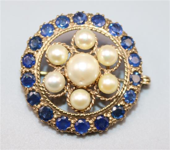 Gold, sapphire and pearl set pierced circle brooch